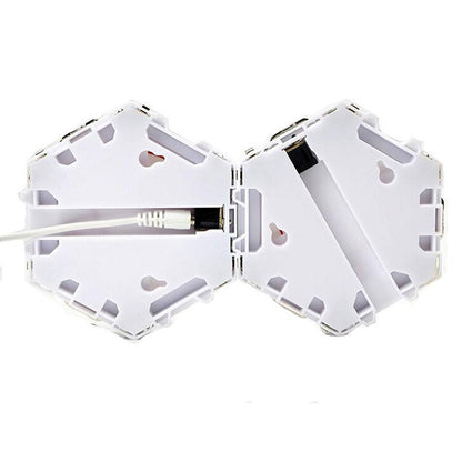 Luminária LED hexagonal modular com acionamento por toque. Foto 4 do produto.